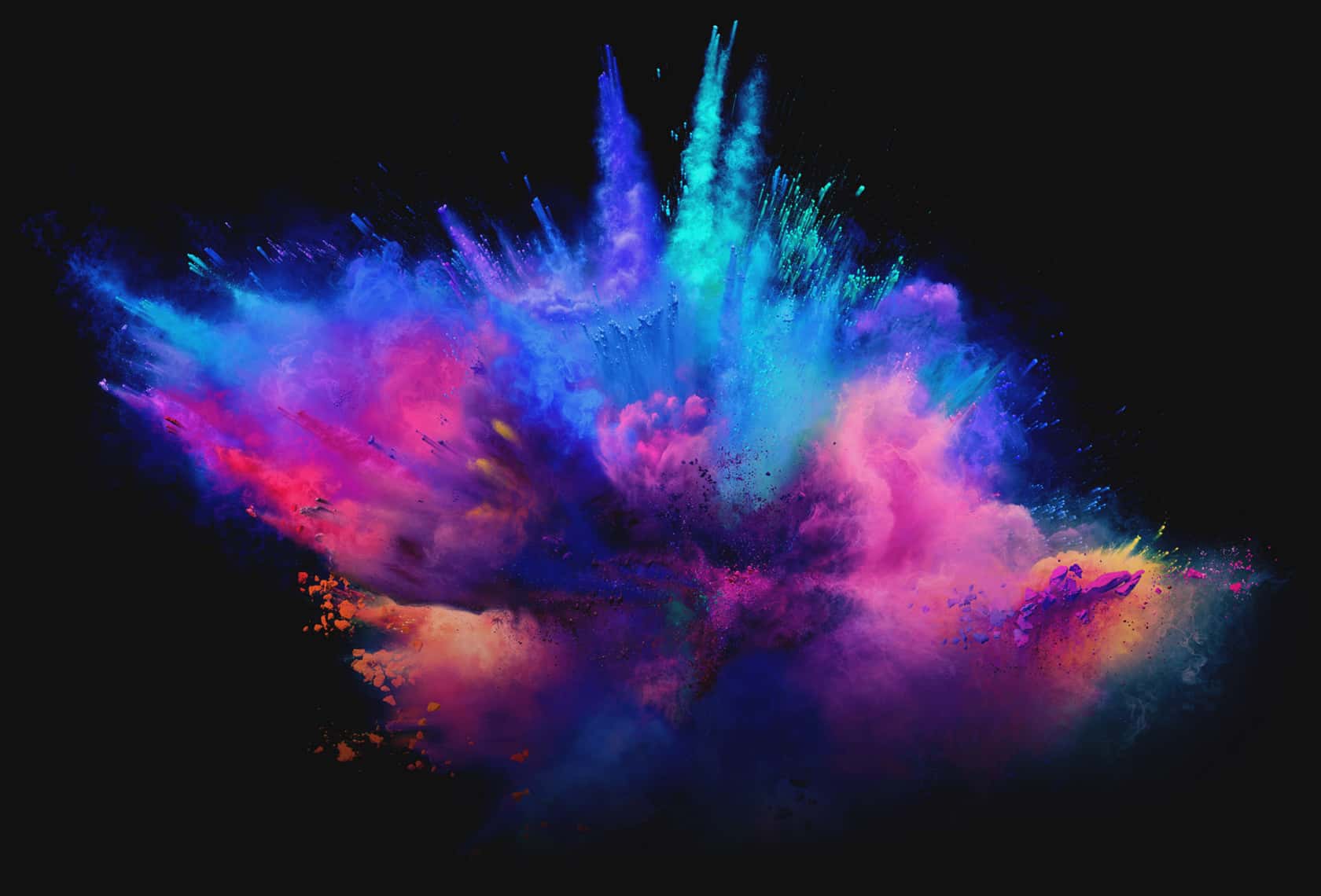 An Eclipse Grey Zephyrus G14 with a simulated colored dust explosion both on screen and behind the laptop.