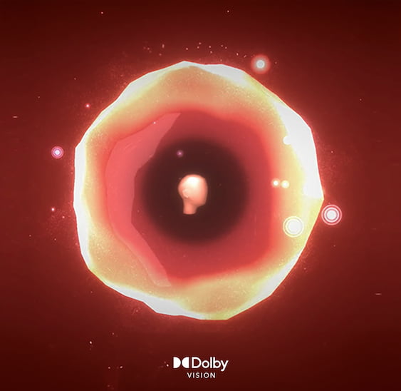 造型橙色物體漂浮在黑色背景上，下方寫著「Dolby Atmos」字樣。