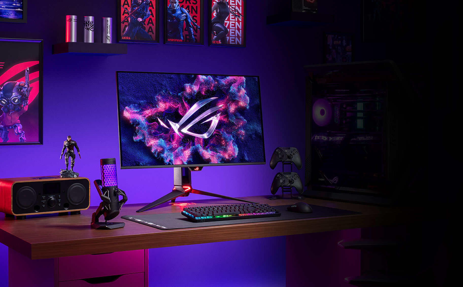A gaming setup comprising of the PG32UCDMR, two controllers, a microphone, a speaker, and keyboard.