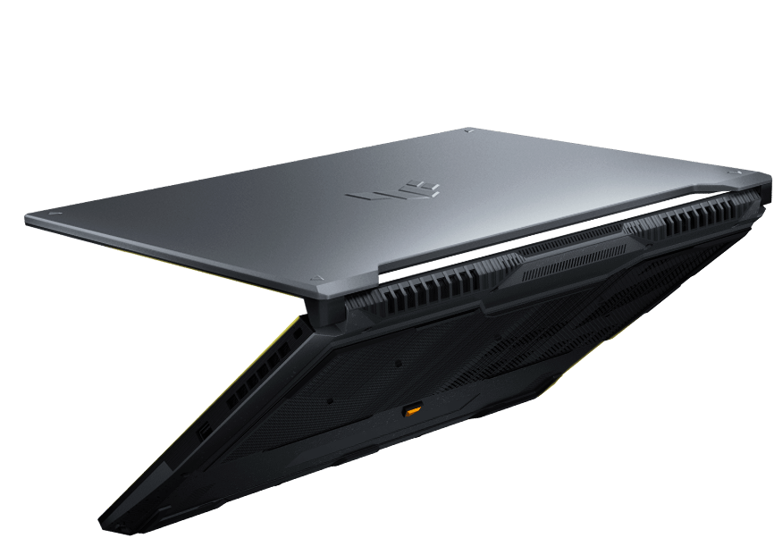 一台 TUF Gaming F16 電競筆電，外蓋半開，背景是破碎的混凝土。
