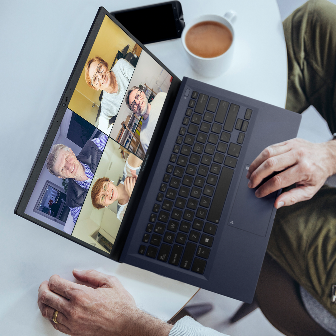 A businessman is in a video-conferencing call.