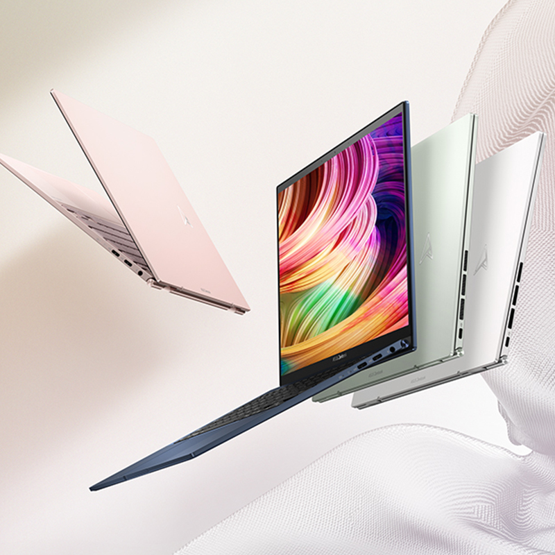Zenbook S 13 OLED floating in the palm of a hand standing on its corner with an Evo badge by its side