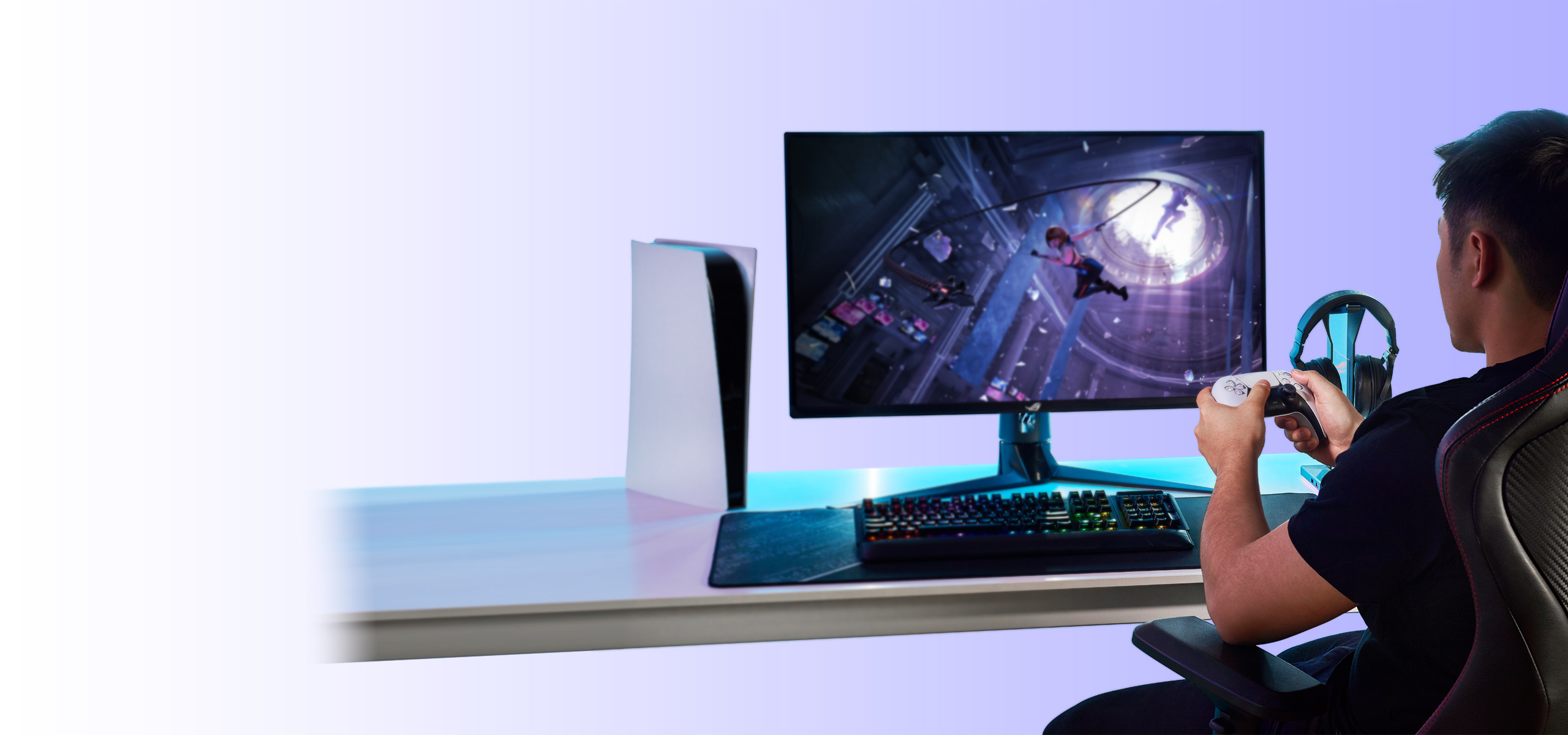 A man plays console game using ASUS gaming monitor.