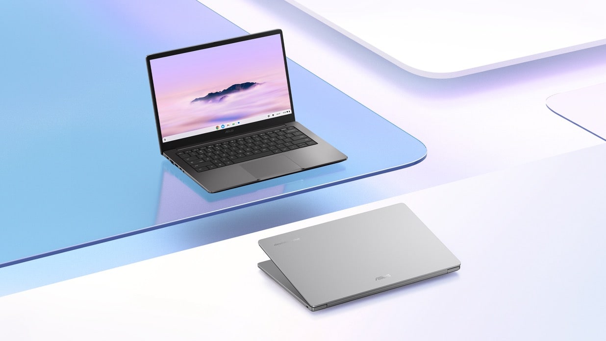 Two ASUS Chromebook Plus CB14, one in clamshell and one closed. Both devices are placed on top of purple glass pieces.