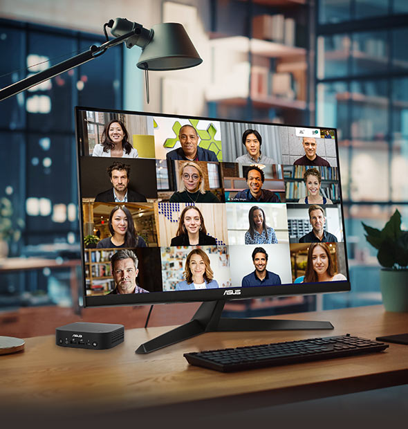 The NUC Mini PC is connected to the monitor on the table, which displays the video conference features