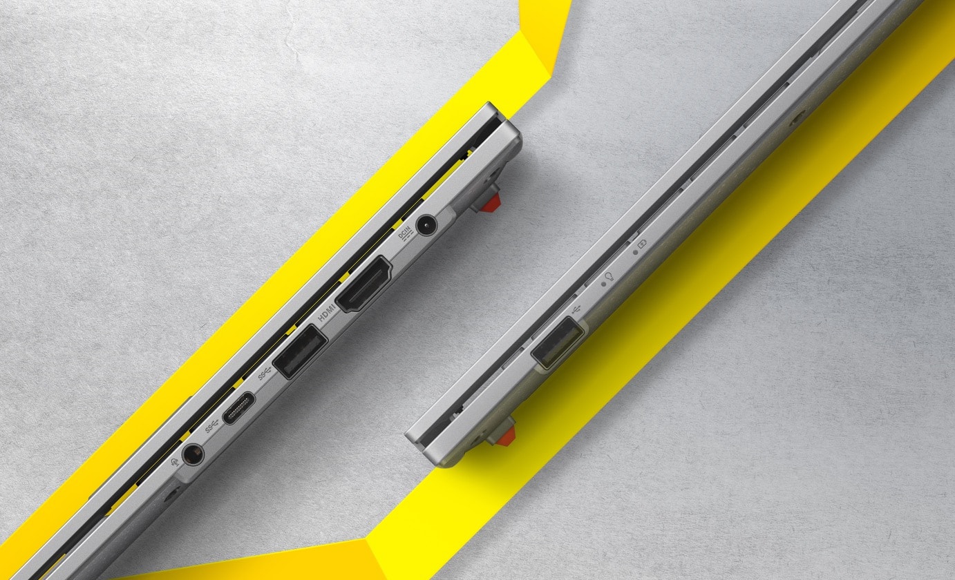 Two Vivobook Go 15 OLED are closed and shown from left-side and right-side views, presenting I/O ports from left to right — an audio jack, a USB 3.2 Gen1 Type-C, two USB 3.2 Gen1 Type-A, a HDMI, a DC-in 1.4 and a USB 2.0. 