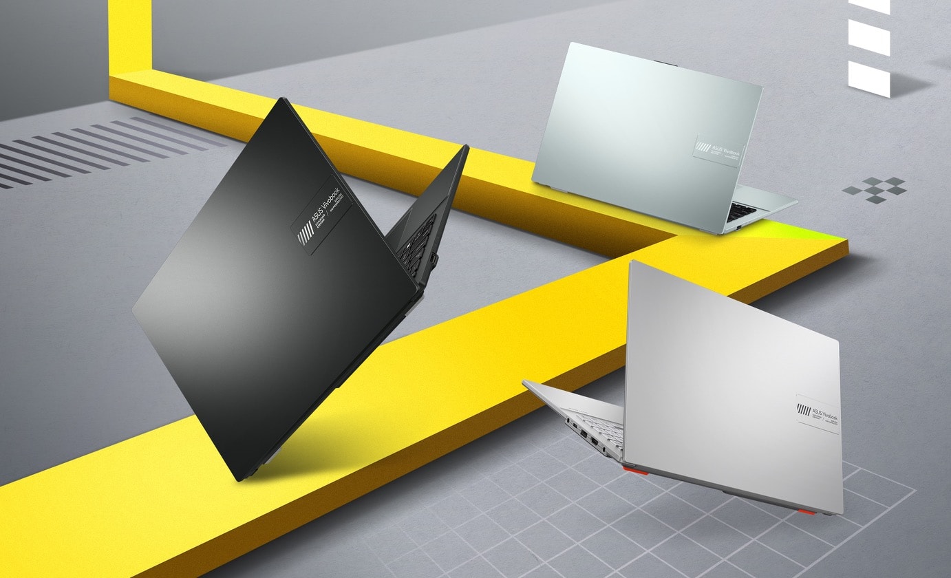 Laptopy Vivobook Go 15 OLED w wariantach Mixed Black, Cool Silver i Grey Green z pokazaną pokrywą. 
