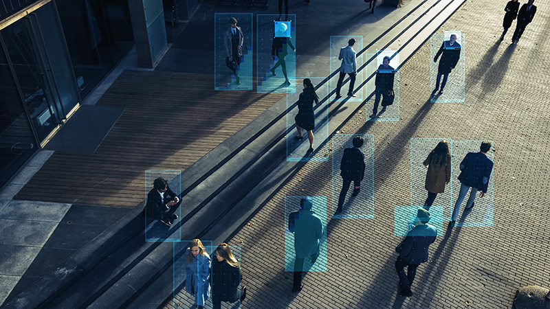 Security Camera Surveillance Footage of a Crowd of People Walking on Busy Urban City Streets