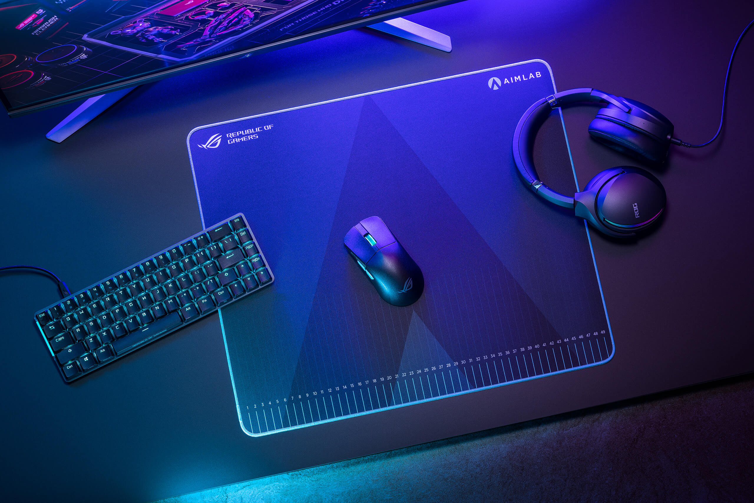 A scenario photo of the ROG Harpe Ace Aim Lab Edition gaming mouse pad in a user setting with ambient lighting