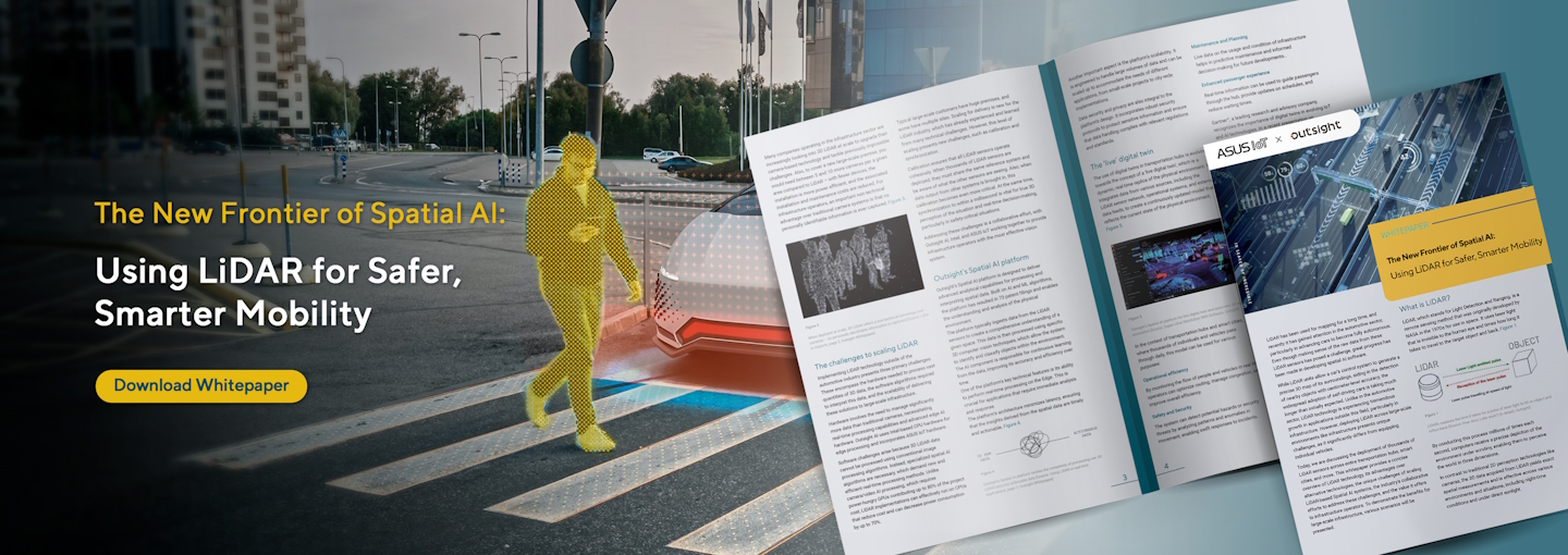 City street with a crosswalk, a yellow-outlined pedestrian figure, and an open booklet showing diagrams and text, with a 'Download Whitepaper' button and the title 'The New Frontier of Spatial AI: Using LiDAR for Safer, Smarter Mobility’