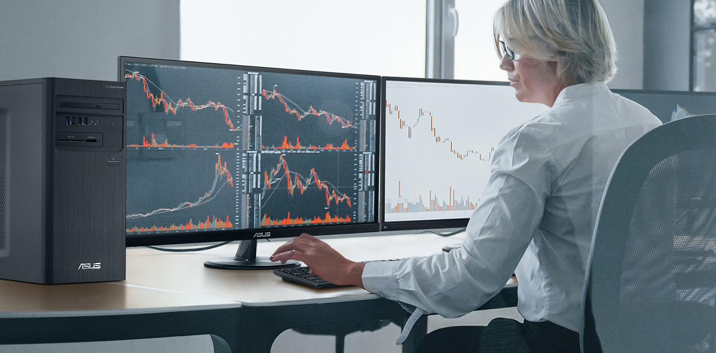 A business woman is monitoring a run chart shown on the ASUS monitors in office.