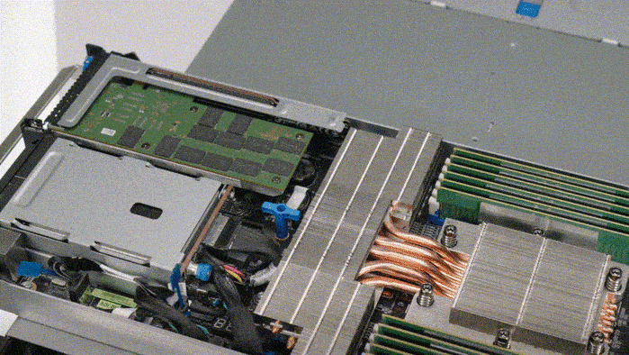 Hands removing a PCIe card from the server using a tool-less bracket design for simplified upgrade and replacement.