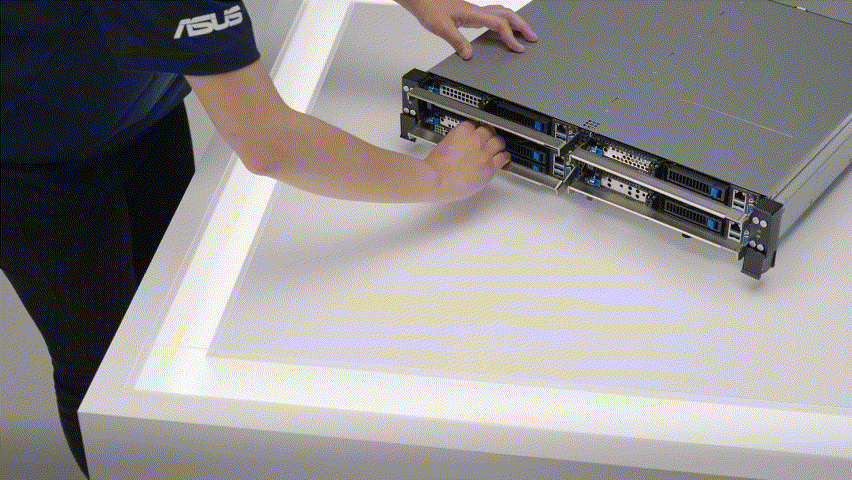 Person demonstrating front-access server node removal from chassis, allowing maintenance without entering hot aisles.