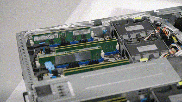 Close-up of ASUS server interior showing CXL memory expander slots and detailed component layout for enhanced memory bandwidth.