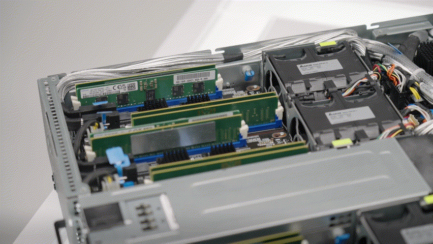 Close-up of ASUS server interior showing CXL memory expander slots and detailed component layout for enhanced memory bandwidth.