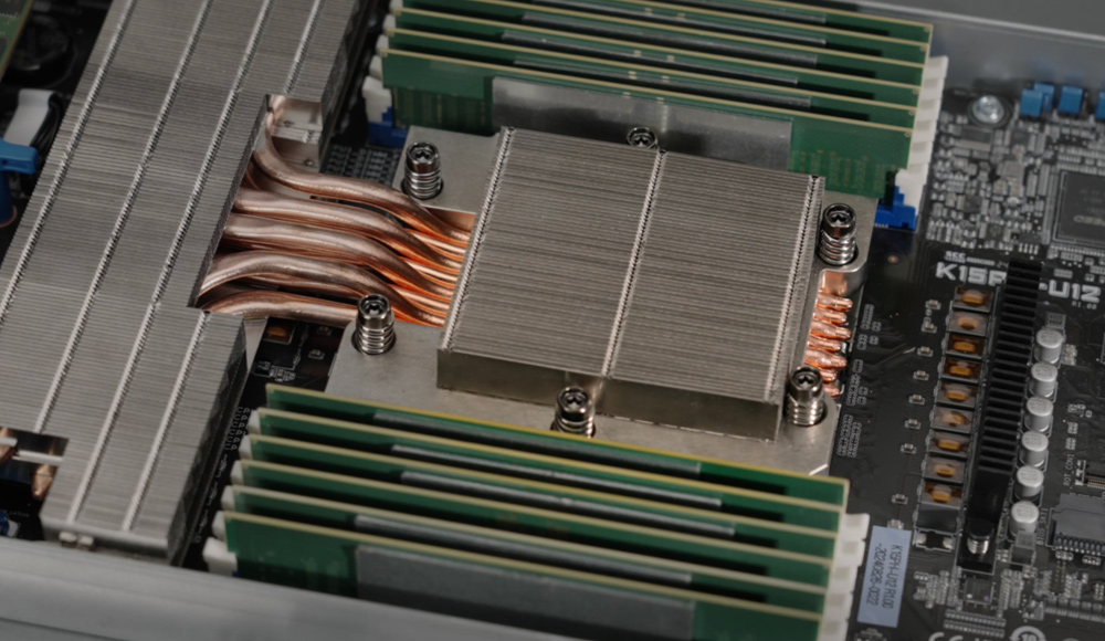 Close-up of EVAC heatpipe thermal module on the ASUS server motherboard, showing direct-contact copper heatpipes and heatsink components for high-efficiency CPU cooling.