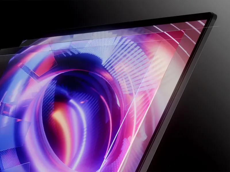 The display of an ROG Strix laptop with an abstract image on screen.