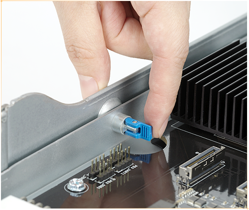 A photo of hands removing thumbscrews without tools for fast and simple access to components.
