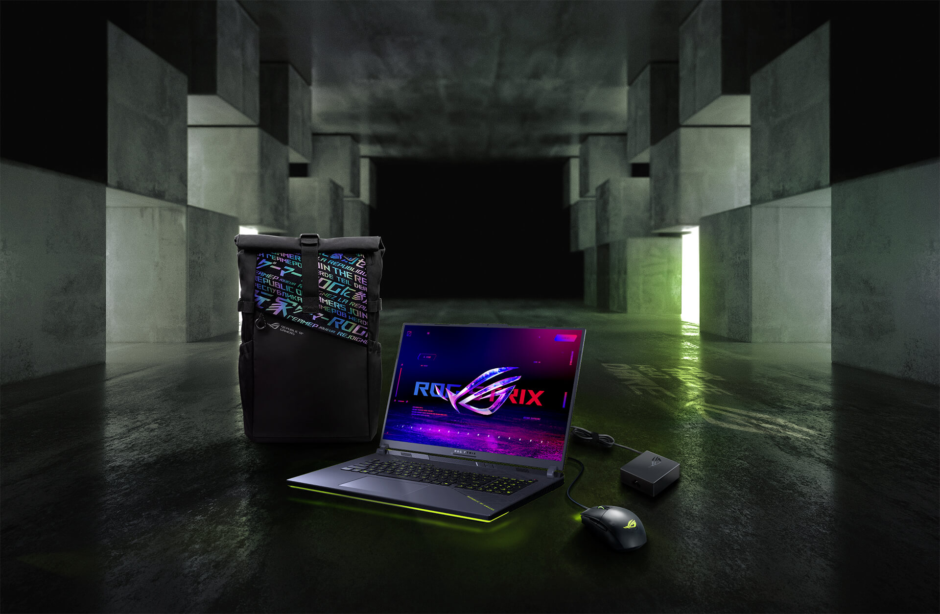 In an underground big space, from left to right; an ROG backpack, G18, ROG Strix Gladius III mouse, and 100W adapter.