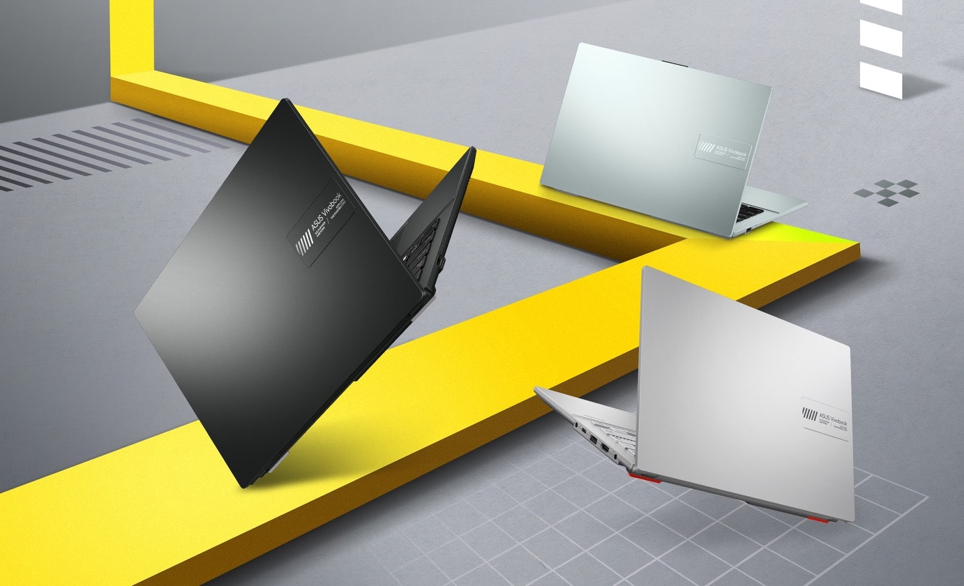 Những chiếc laptop Vivobook Go 14 màu Đen tổng hợp, Bạc xám và Xanh lá xám đang để lộ phần nắp. 