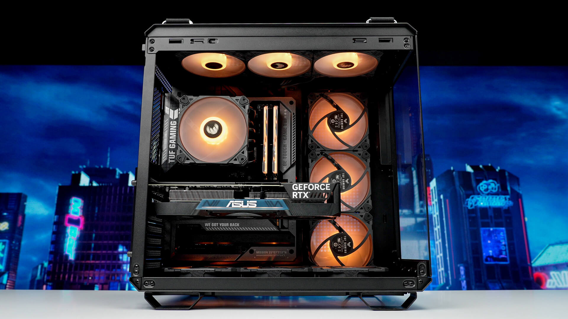 A full screen advanced BTF PC build with orange lighting shows clean and cable-free PC build.