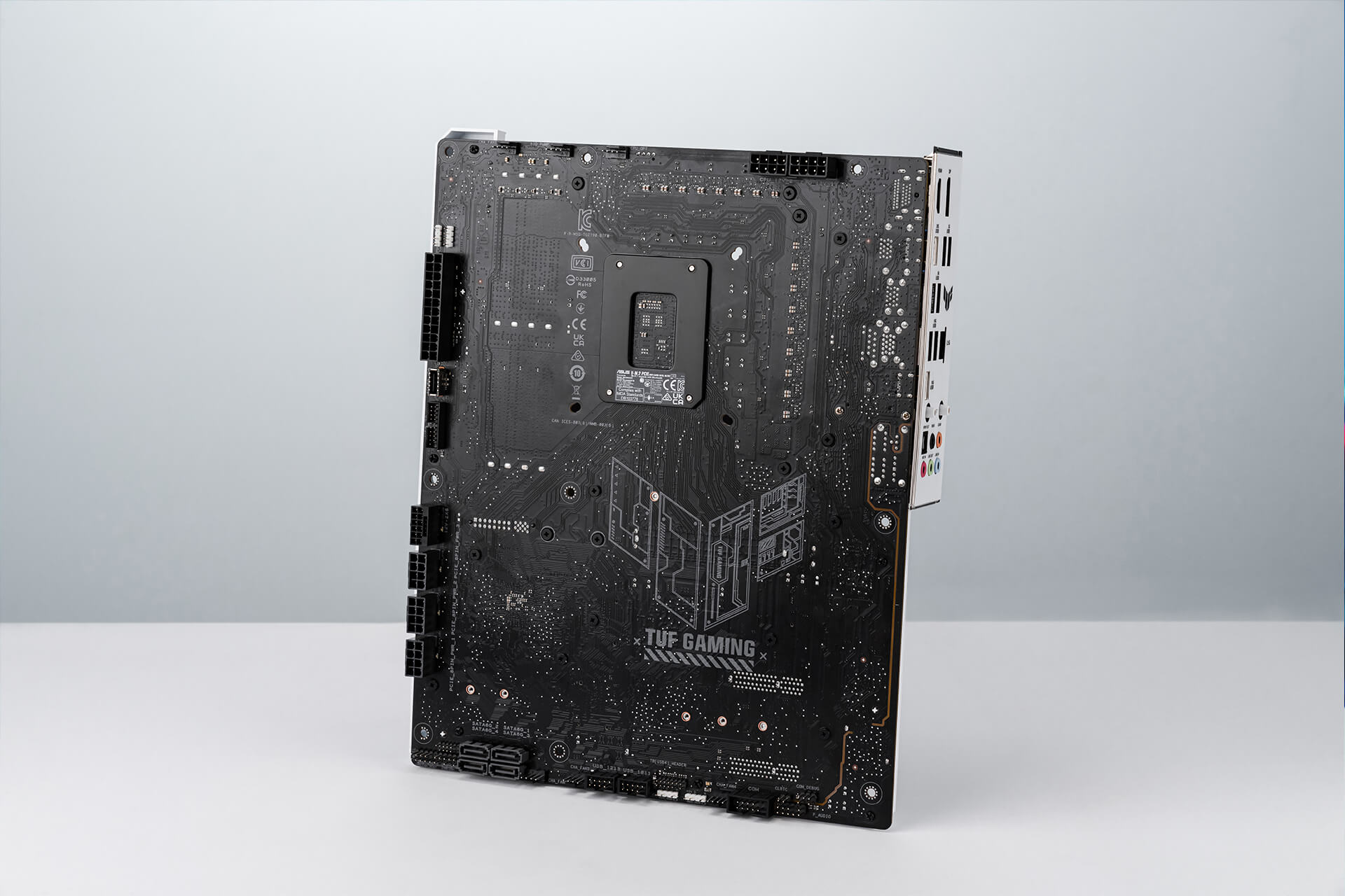 TUF GAMING Z790-BTF WIFI motherboard backside shows the hidden connector design that standing in the middle with white background.