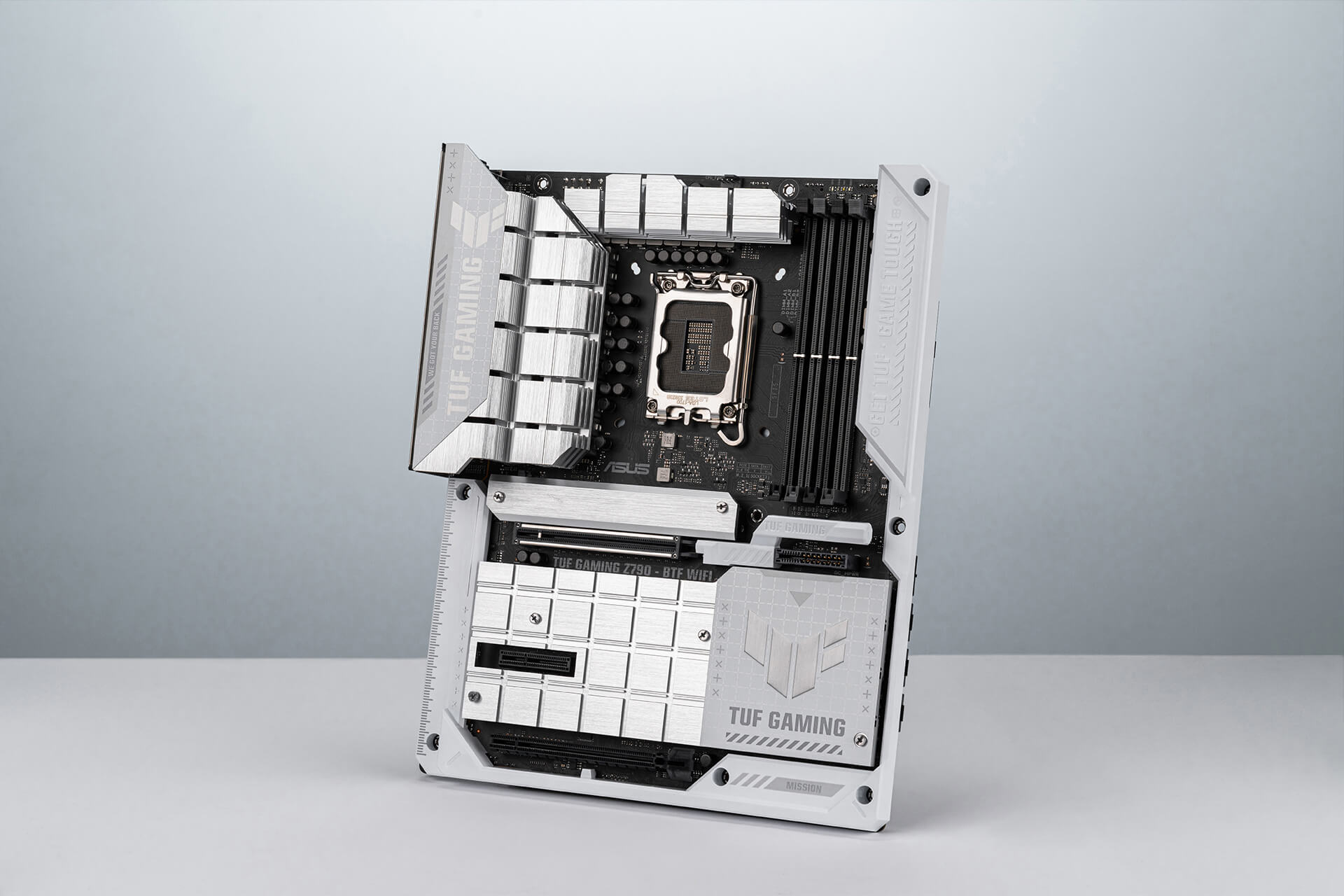 A 45˚ angle of TUF GAMING Z790-BTF WIFI motherboard stands in the middle with white background.