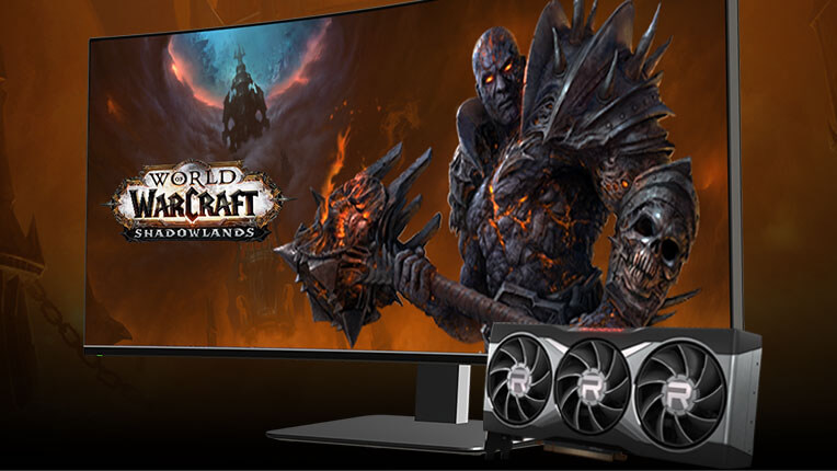 A monitor displaying World of Warcraft Shadowlands artwork, with an AMD Radeon graphics card placed to the side