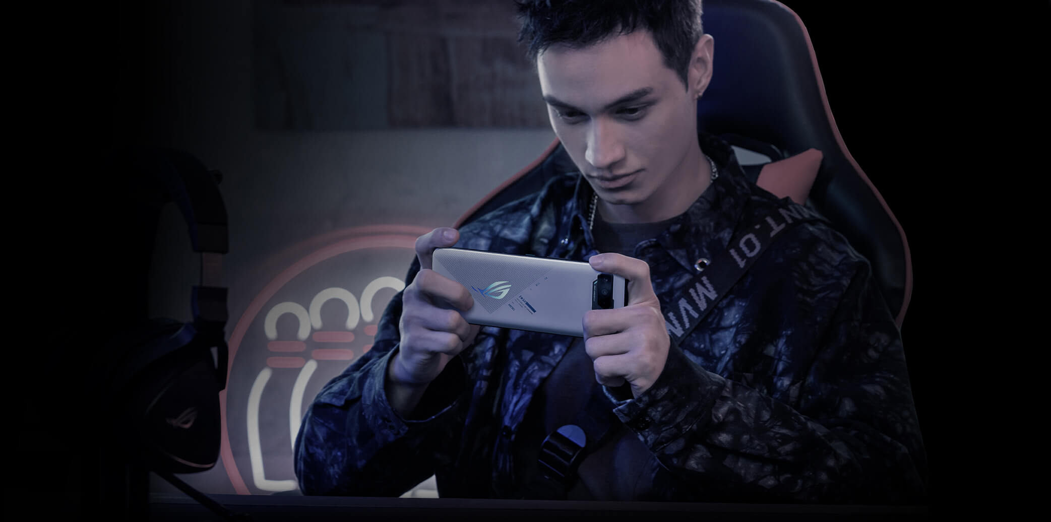 A man playing game with ROG phone