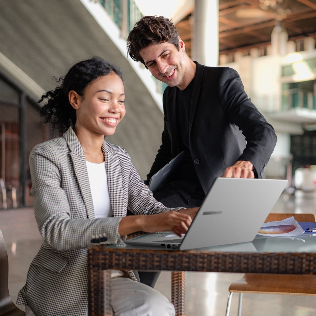 Two employees discussing a project outside using Expertbook P Series