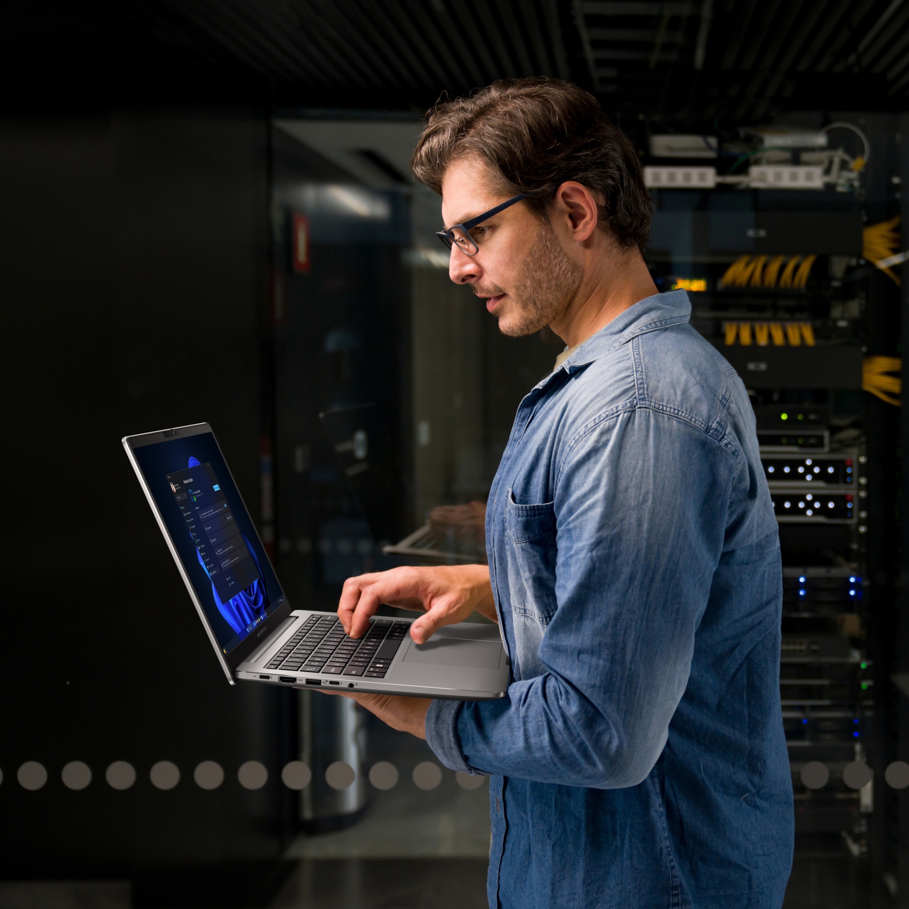 A male IT technician using Expertbook P series to check for software updates