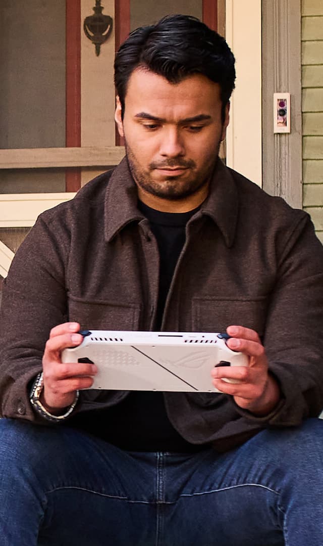 The picture of man playing with ROG ALLY