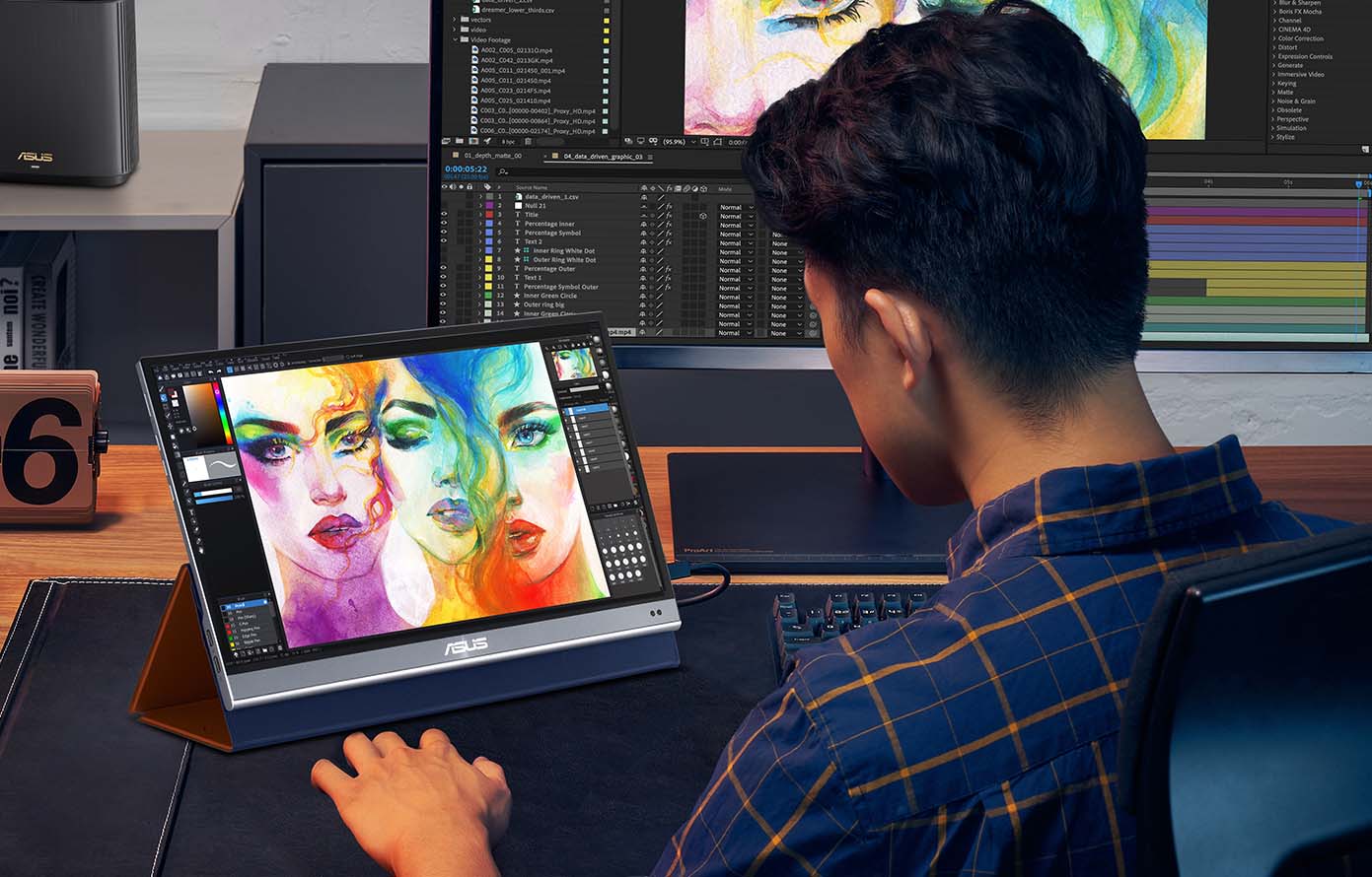 A designer is working on photoshop on the second screen of a ZenScreen MQ16AH portable monitor