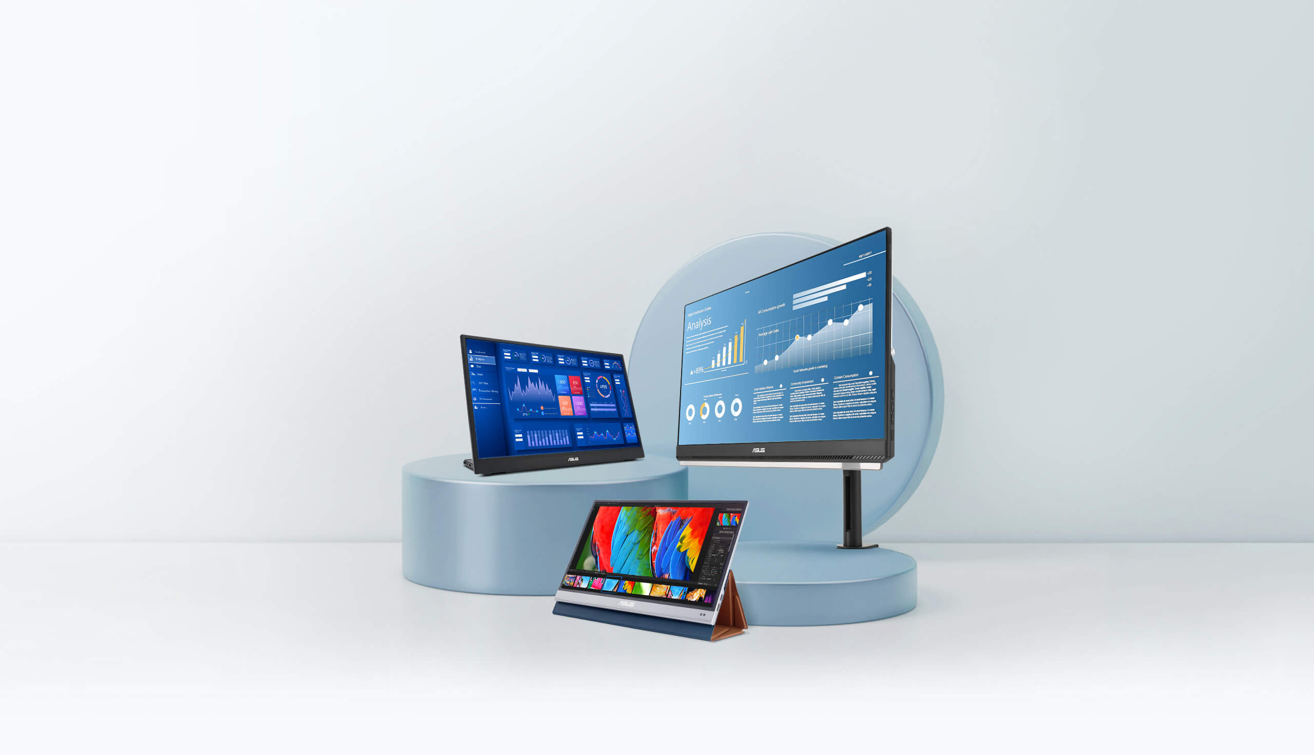 Three ZenScreen portable monitors display on the podium, the model MB16QHG, MQ16AH, and MB249C from left to right