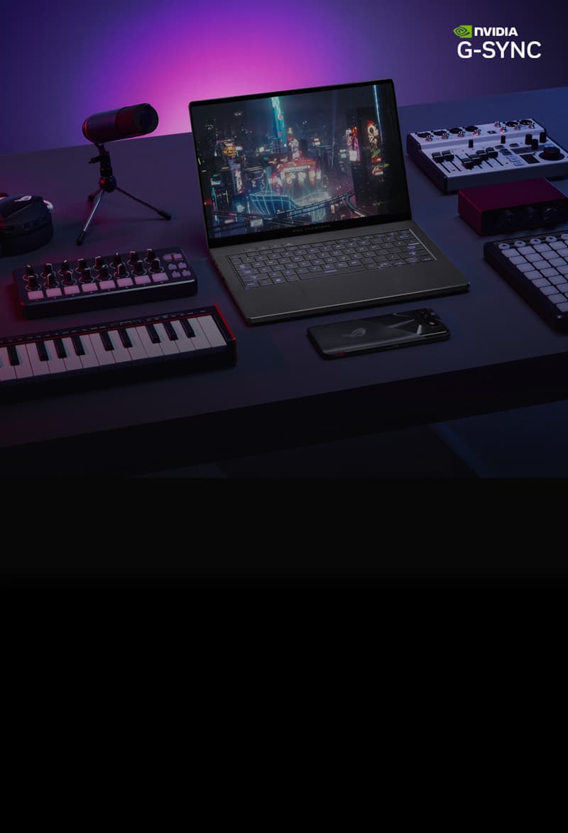 An ROG Zephyrus G14 sits on table with the lid open and a cyberpunk scene on screen, flanked by digital music production equipment, and ROG Phone, and ROG Carnyx microphone, and an ROG headset.