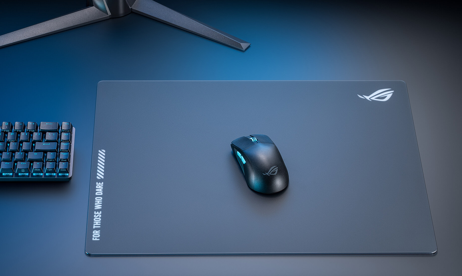 The black ROG Moonstone Ace L mouse pad in a full set up with the black ROG Harpe Ace Aim Lab Edition