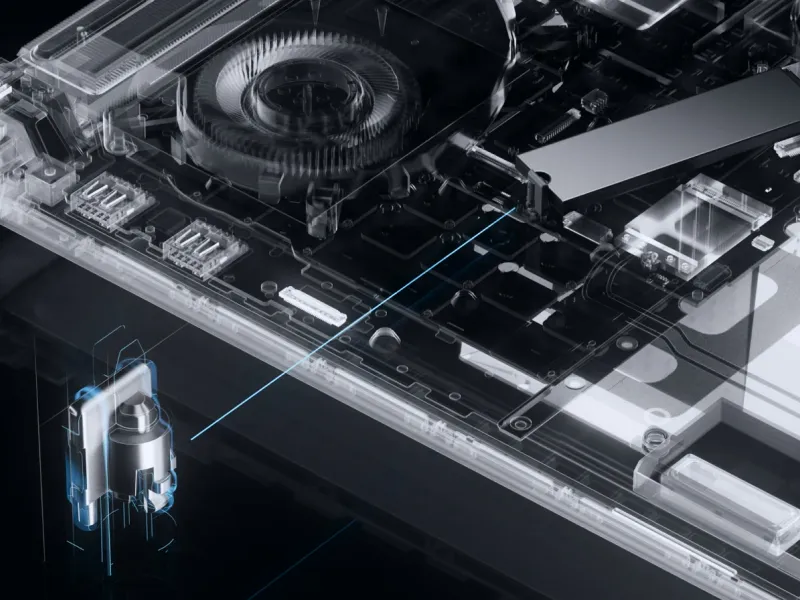 An X-Ray view of an ROG Strix laptop, with fans, storage, and other circuitry shown.