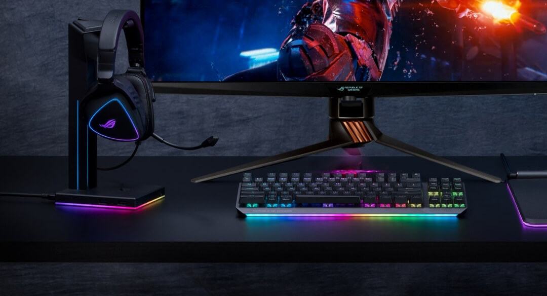 ROG Swift PG32UQX showing lighting synchronized with headset base, headset and mouse pad