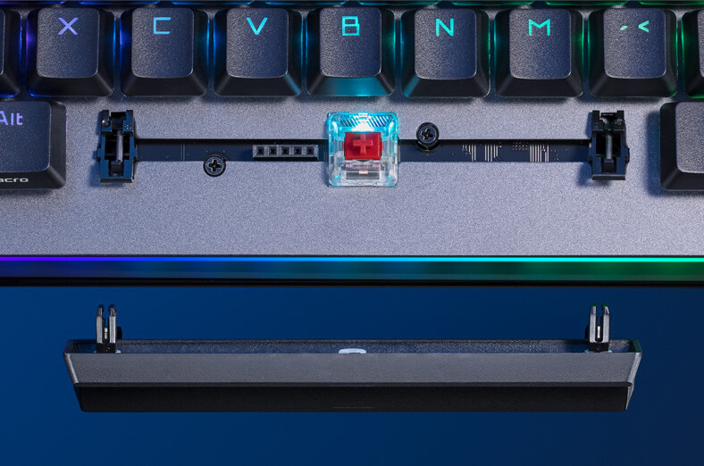 A close-up of ROG Strix Flare II Animate space-bar area, with keycap removed and laid on the bottom, showing the switch stabilizer