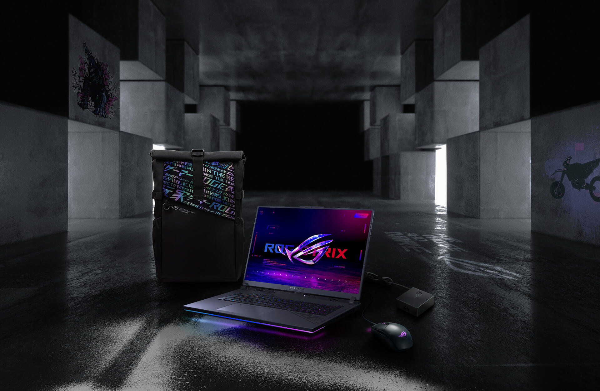 In an underground big space, from left to right; an ROG backpack, G18, ROG Strix Gladius III mouse, and 100W adapter.