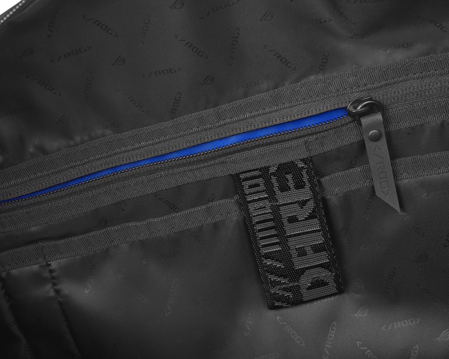 Extreme close-up of the interior zipper of the ROG SLASH Duffle Bag