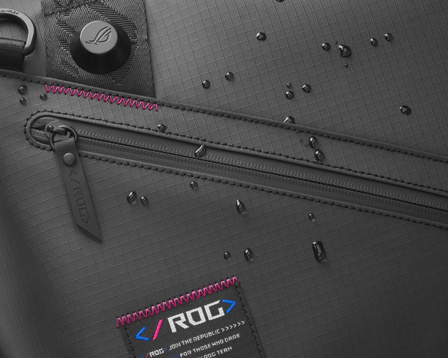 Exterior shot of the main zipper on the ROG SLASH Duffle Bag, with emphasis on the water resistant materials