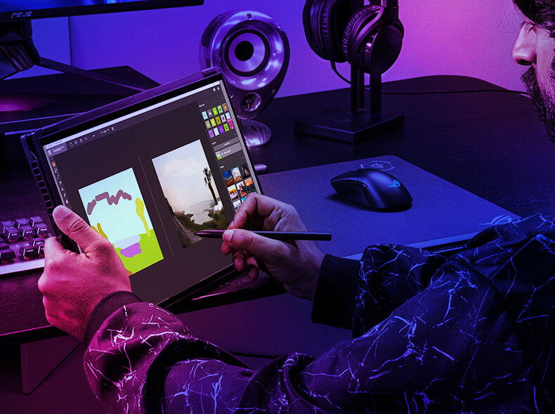 The ROG Flow X16 laptop resting on a desk with a person holding up the laptop screen with their left hand while drawing on the screen with right hand with ASUS stylus pen.