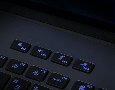 Et nærbilde av dedikerte volum-, demp- og ROG-taster langs toppen av et bærbart tastatur.