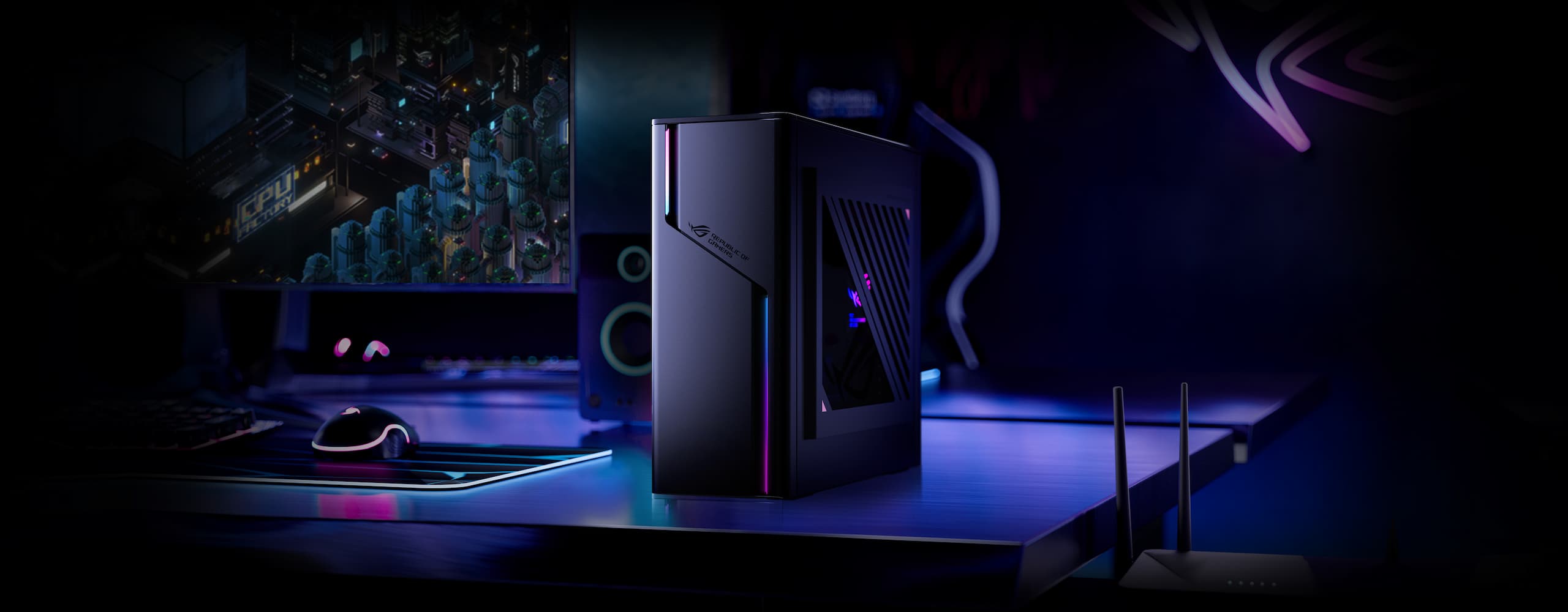 The ROG G22 computer sitting on a desk in a dark room.