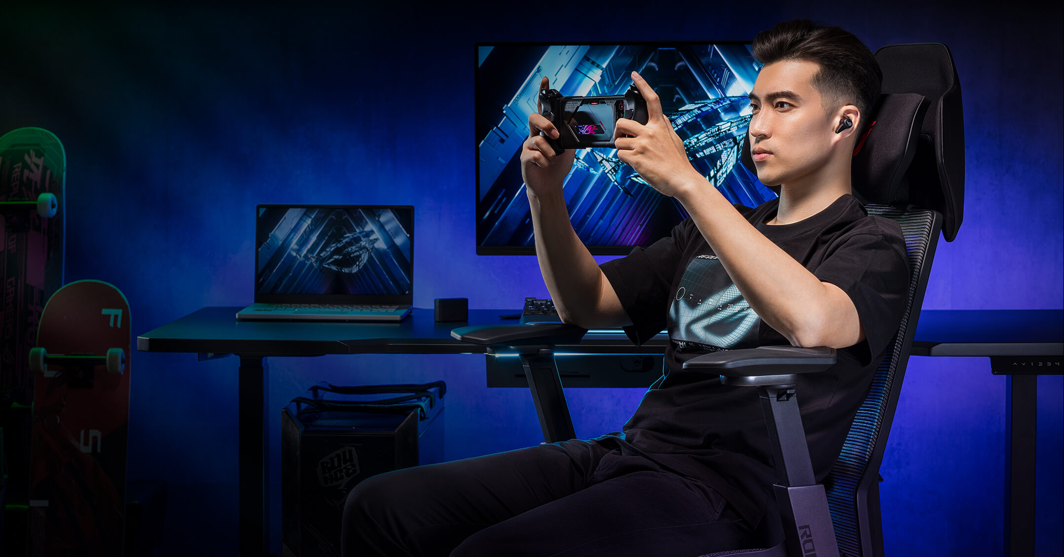 A guy gaming on mobile using the mobile gaming mode of ROG Destrier Ergo Gaming Chair