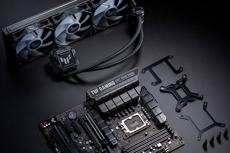 A TUF Gaming motherboard and AIO Cooler on the table