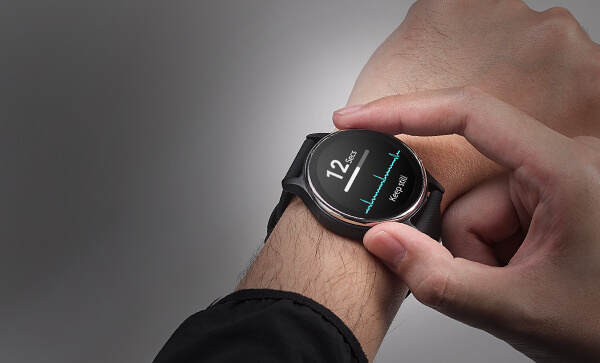 A man's wrist is wearing ASUS VivoWatch 6 and his finger is touching watch's side sensor for vital sign measurement