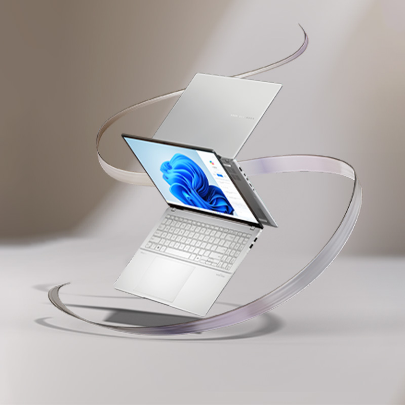 A wide-open ASUS Vivobook S16 (M5606) showing the physical keyboard half-covering the lower screen.