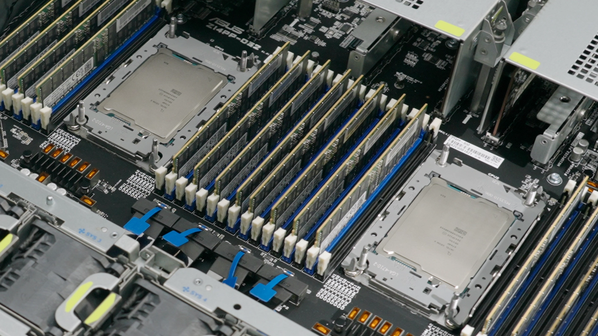 A close-up image of the server motherboard with multiple memory modules (RAM sticks) and several large processors (CPUs) installed